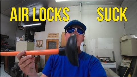 Video still: fixing an airlock in a hot tub
